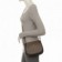 bolsa-transversal-feminina-com-tampa-de-tachas