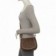 bolsa-feminina-transversal-com-tampa-detalhes-vazados-e-tachas