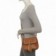 bolsa-transversal-feminina-com-tachas-e-tassel