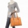 bolsa-de-verniz-feminina-com-vazados-e-detalhes-metalicos